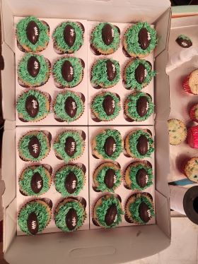 Footballs on top of frosting grass